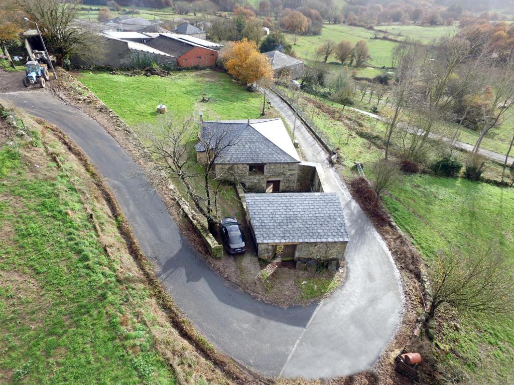 an aerial view of a house on a road at Casiña de Campo in Ferreiros