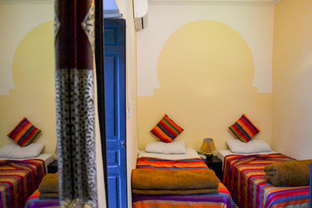 Кровать или кровати в номере Riad Sijane