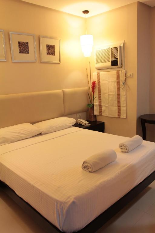 Postel nebo postele na pokoji v ubytování Hotel Stella