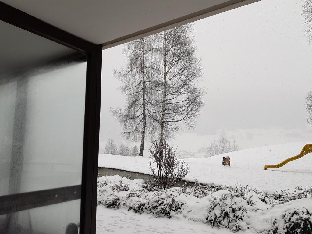 Casa con vista a Moena v zimě