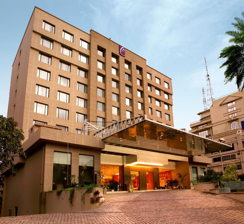 a hotel building with a brick driveway in front of it at The Chancery Pavilion in Bangalore