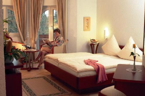 Postel nebo postele na pokoji v ubytování Hostellerie Bacher