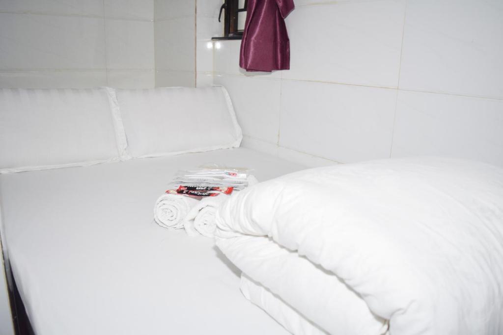 Postel nebo postele na pokoji v ubytování Pay-Less Guesthouse (7/F A9)