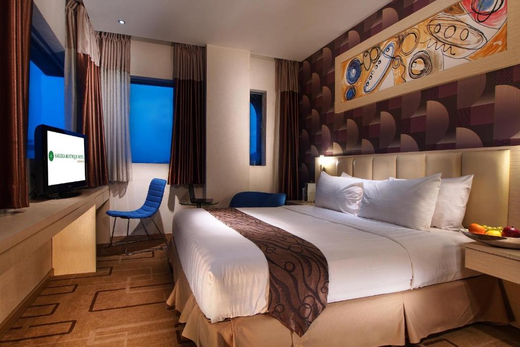 Postel nebo postele na pokoji v ubytování Karibia Boutique Hotel