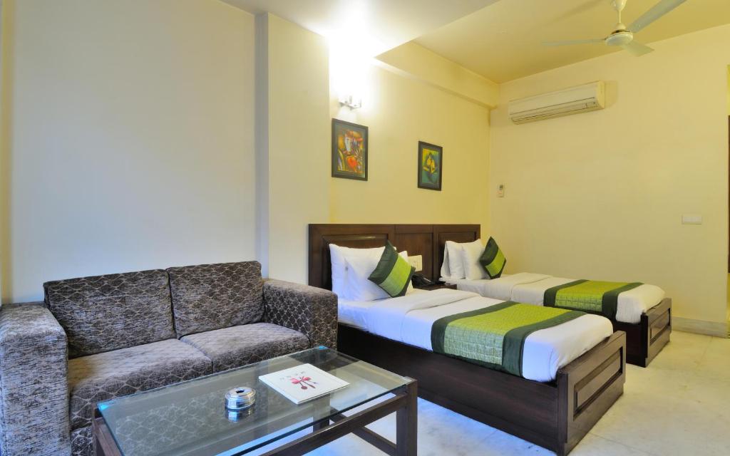 Postel nebo postele na pokoji v ubytování Hotel Shanti Villa