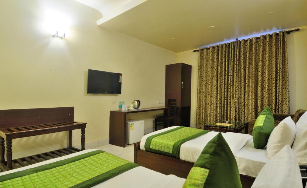 Postel nebo postele na pokoji v ubytování Hotel Shanti Villa