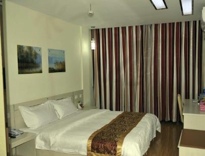 Ένα ή περισσότερα κρεβάτια σε δωμάτιο στο Thank Inn Chain Hotel Shandong Dezhou Ningjin Zhengyang Road Xinhua Building