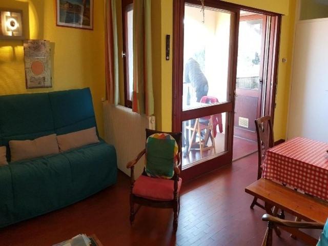 a living room with a couch and a table at 5VSE-LAM56 Appartement avec vue sur la baie in Collioure