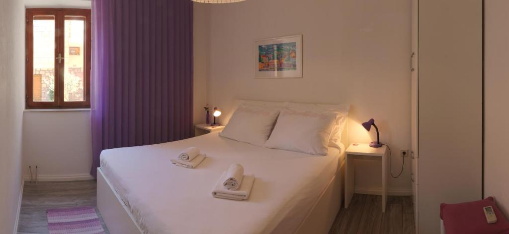 Postel nebo postele na pokoji v ubytování SD House Rooms