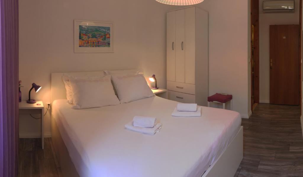 Postel nebo postele na pokoji v ubytování SD House Rooms
