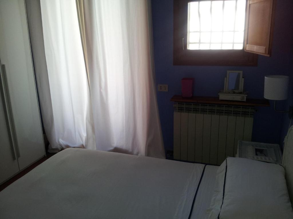 A bed or beds in a room at sole mare versilia