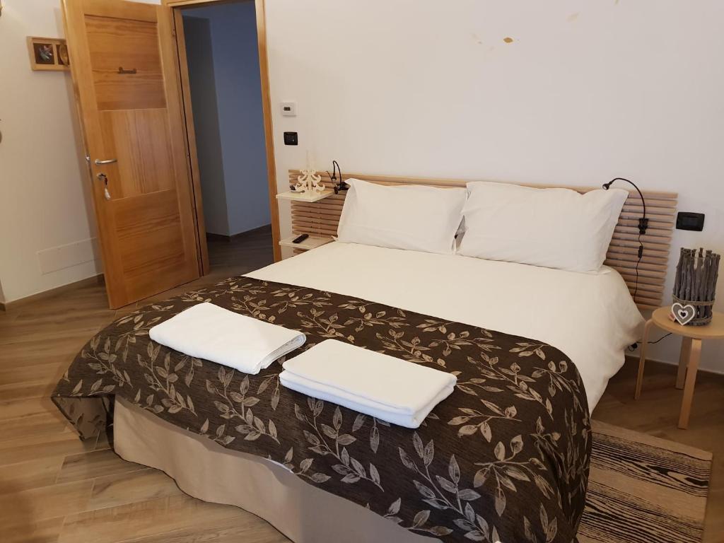 Postel nebo postele na pokoji v ubytování La Corte B&B
