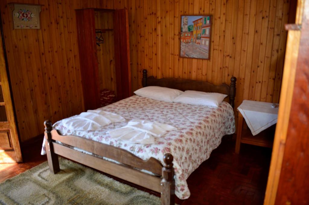 Postel nebo postele na pokoji v ubytování Chalés Dona Zenta