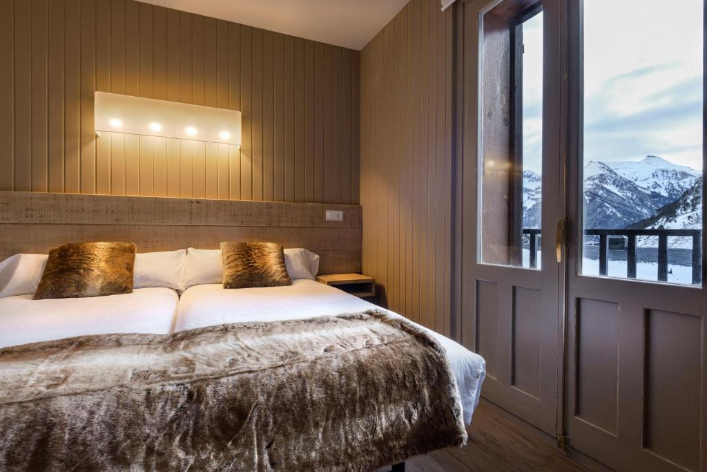 Postel nebo postele na pokoji v ubytování Hotel Tobazo