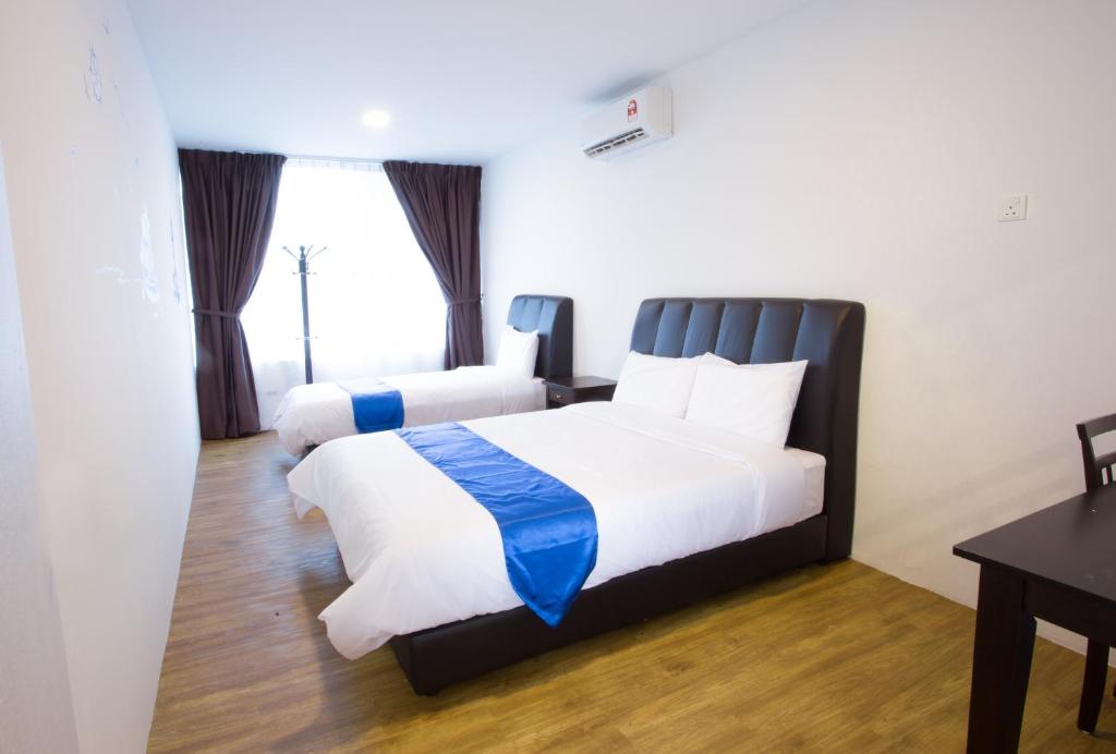 Postel nebo postele na pokoji v ubytování Hard Rock VIP Guest House