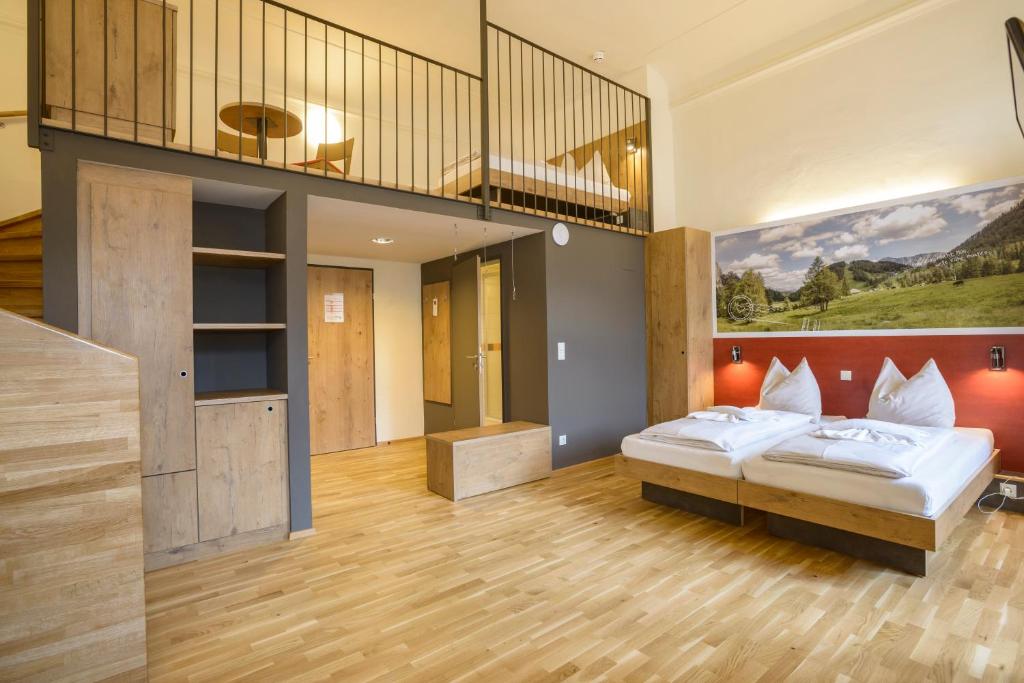 Postel nebo postele na pokoji v ubytování JUFA Hotel Spital am Pyhrn