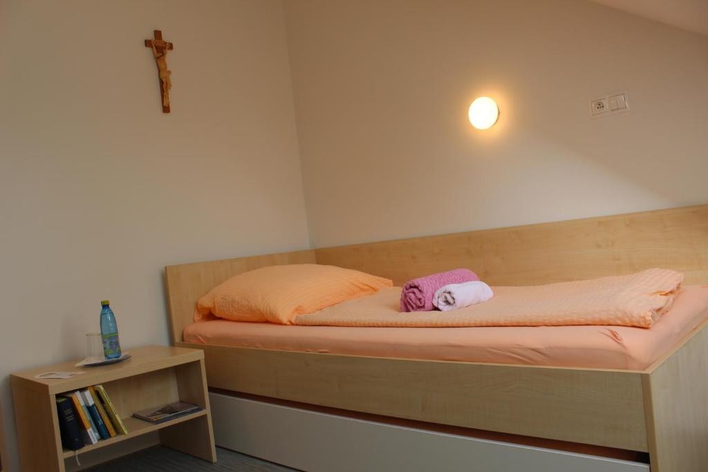 Postel nebo postele na pokoji v ubytování Centrum Salvator