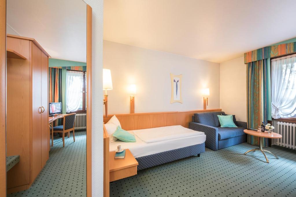 Postel nebo postele na pokoji v ubytování Hotel Monika