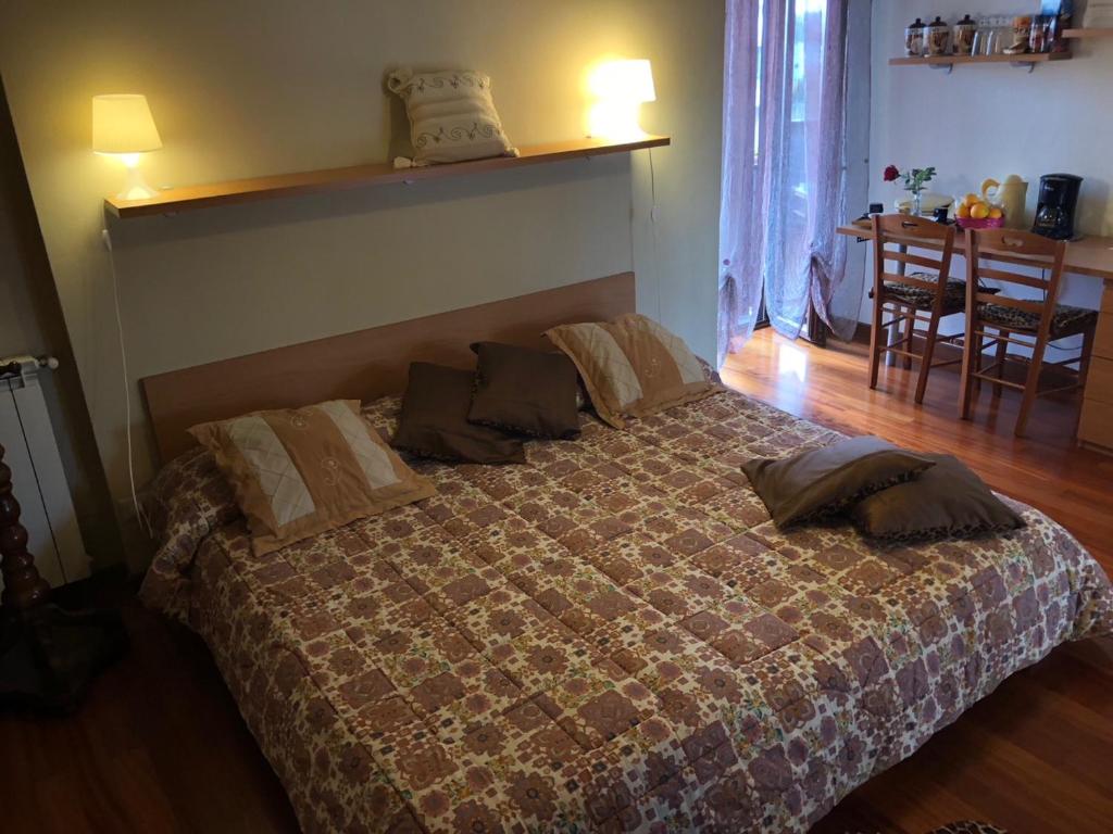 a bedroom with a large bed with pillows on it at B&B La Terrazza in Rome
