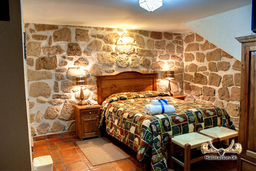 Postel nebo postele na pokoji v ubytování Hotel Casa del Anticuario