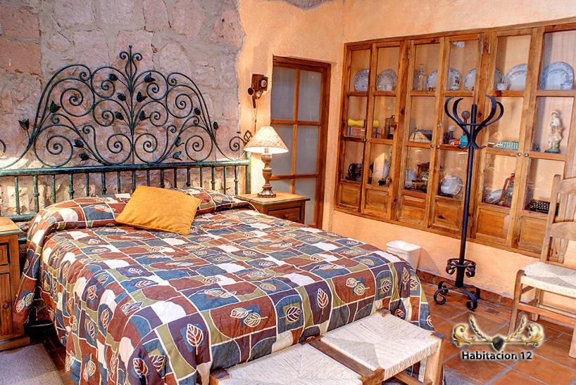 Postel nebo postele na pokoji v ubytování Hotel Casa del Anticuario