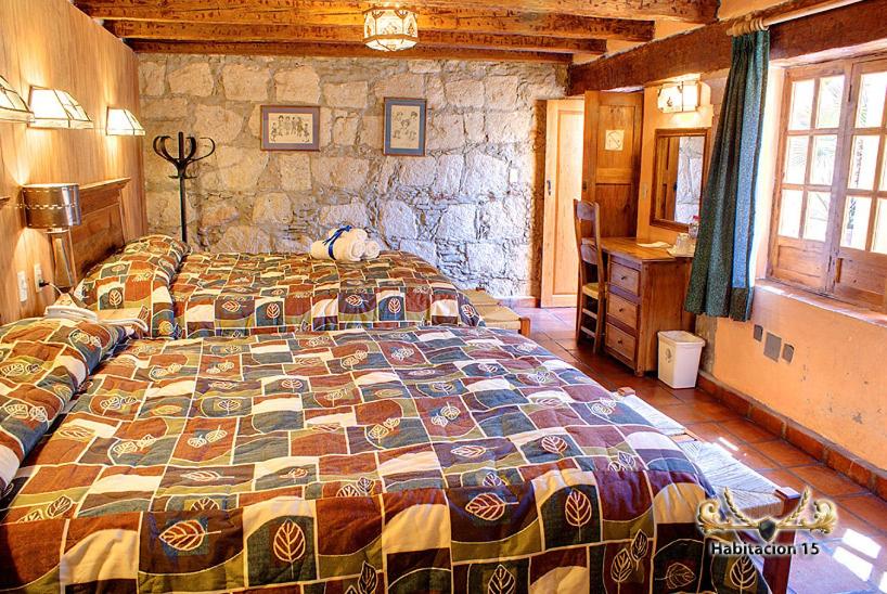 Postel nebo postele na pokoji v ubytování Hotel Casa del Anticuario