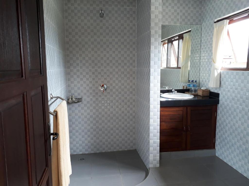 Kuchyň nebo kuchyňský kout v ubytování Nyoman Sandi Guest House