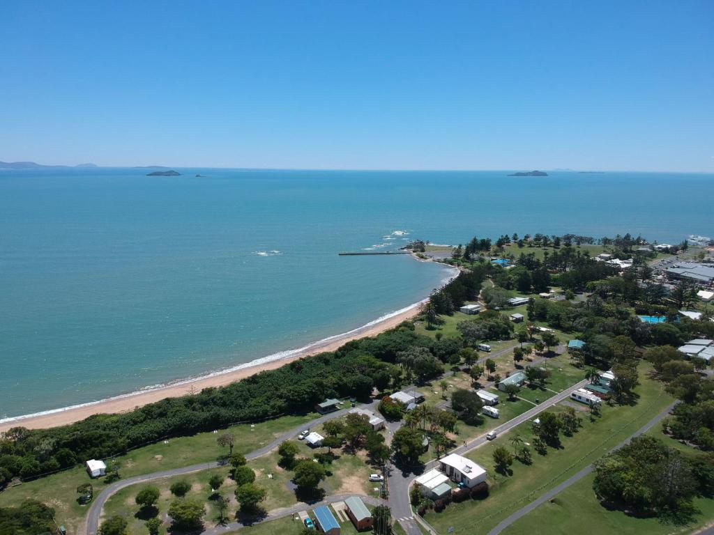an aerial view of a beach and the ocean at Tasman Holiday Parks - Fisherman's Beach in Emu Park