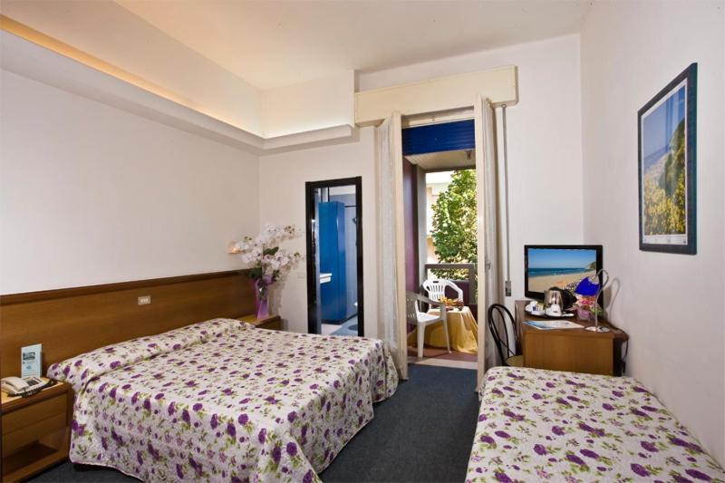 Postel nebo postele na pokoji v ubytování Hotel San Marco