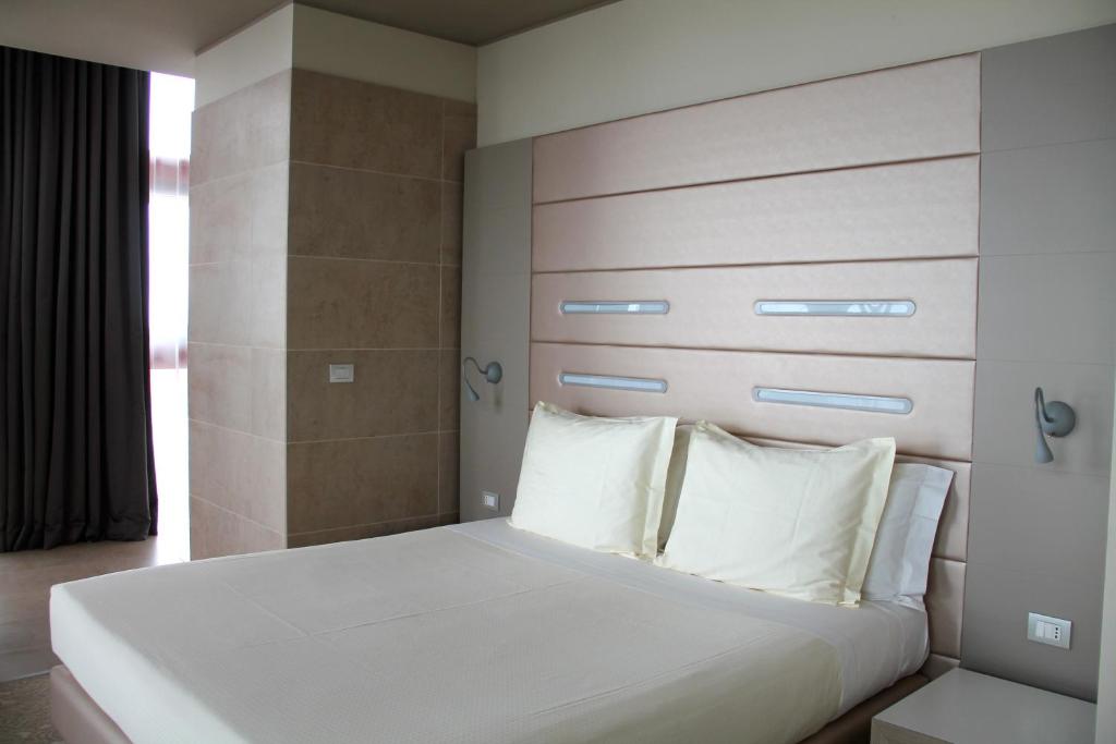 Krevet ili kreveti u jedinici u okviru objekta Best Western Plus Net Tower Hotel Padova
