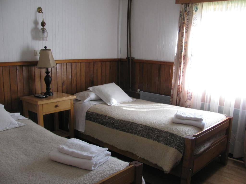 Postel nebo postele na pokoji v ubytování Hotel Mi Casa