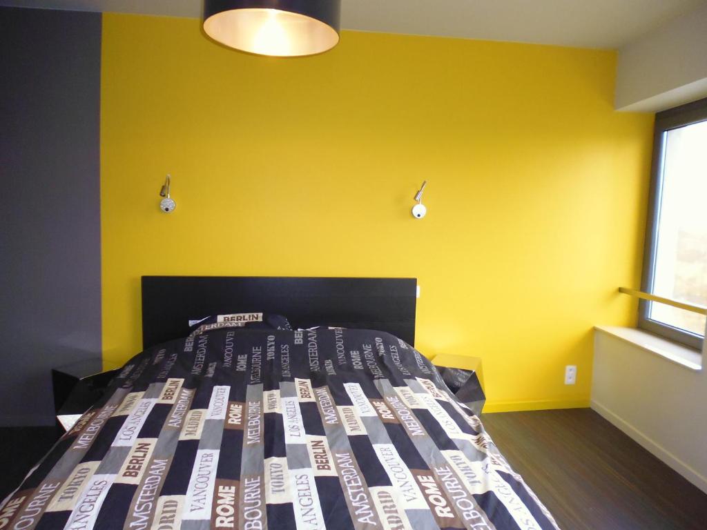 Postel nebo postele na pokoji v ubytování Gîte Les 4 Vins