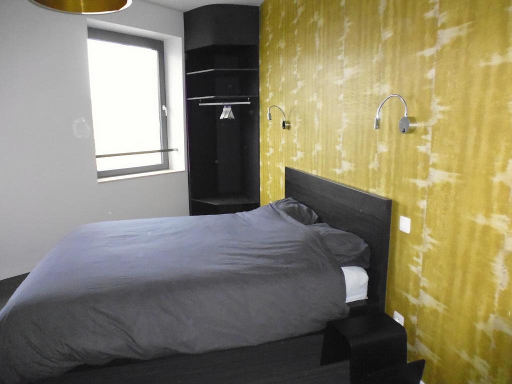 Postel nebo postele na pokoji v ubytování Gîte Les 4 Vins