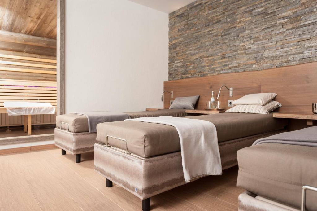 Postel nebo postele na pokoji v ubytování Hotel Monika