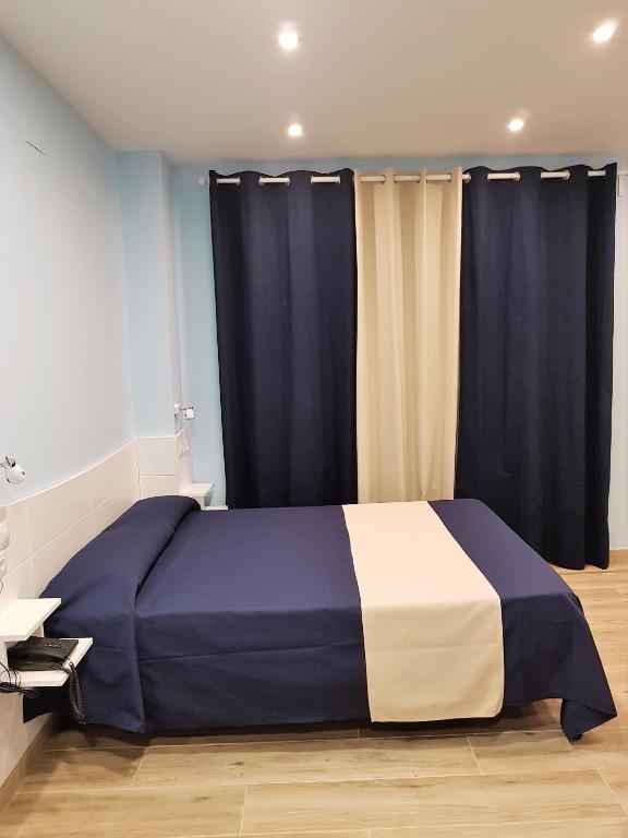 Cama o camas de una habitación en Avenida De America Tijcal