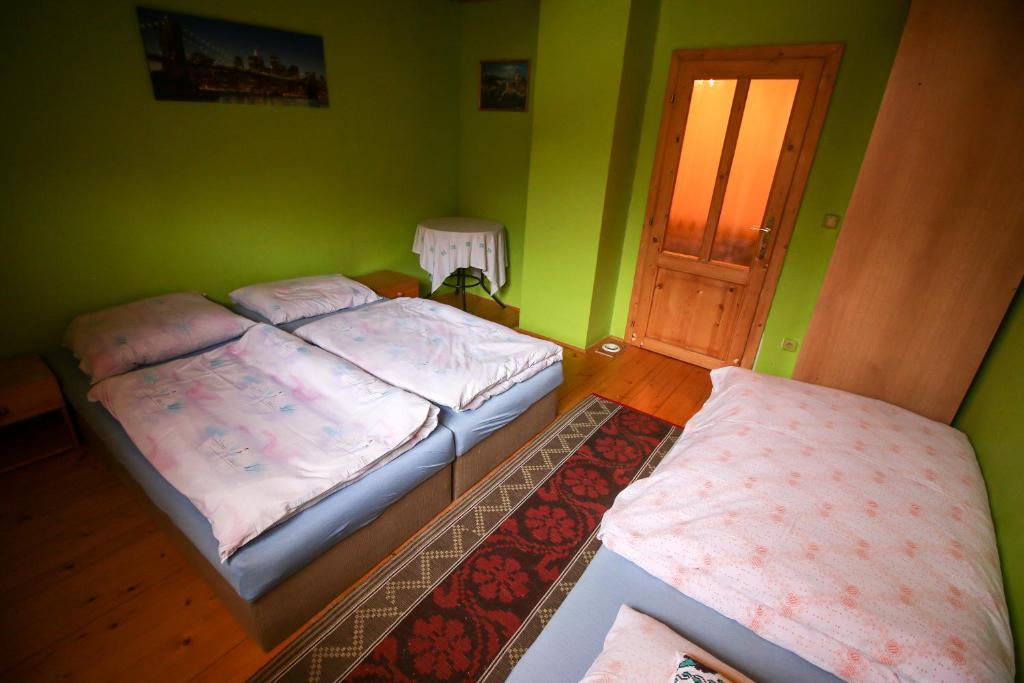 Posteľ alebo postele v izbe v ubytovaní Penzion HACIENDA
