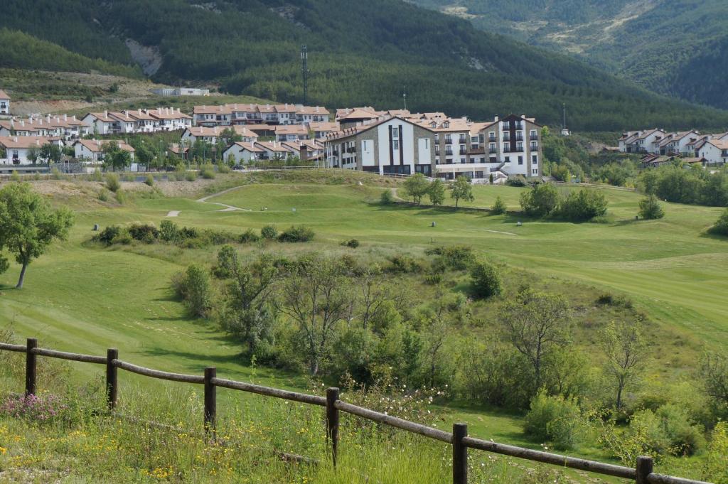 a view of a golf course in a village at Rural Badaguas in Jaca