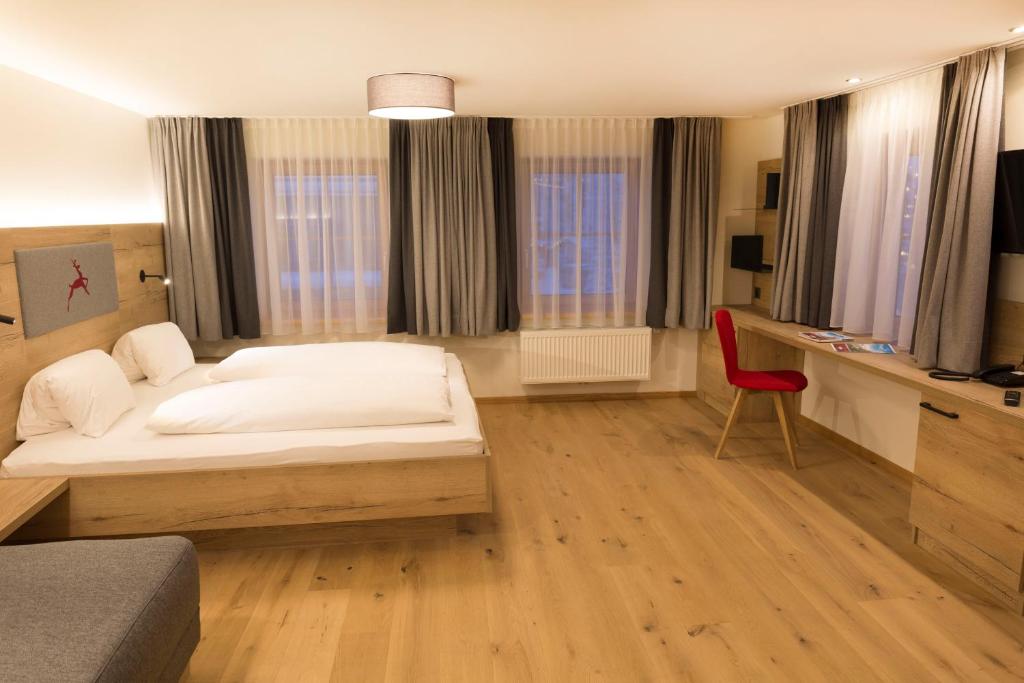 Posteľ alebo postele v izbe v ubytovaní Hotel Rosner