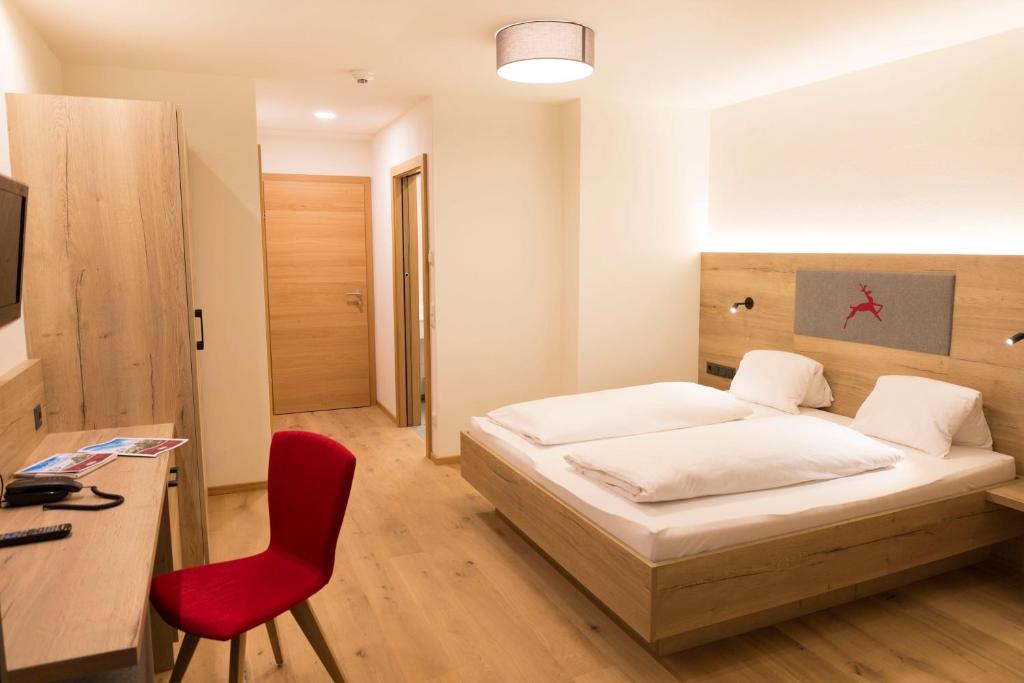 Posteľ alebo postele v izbe v ubytovaní Hotel Rosner