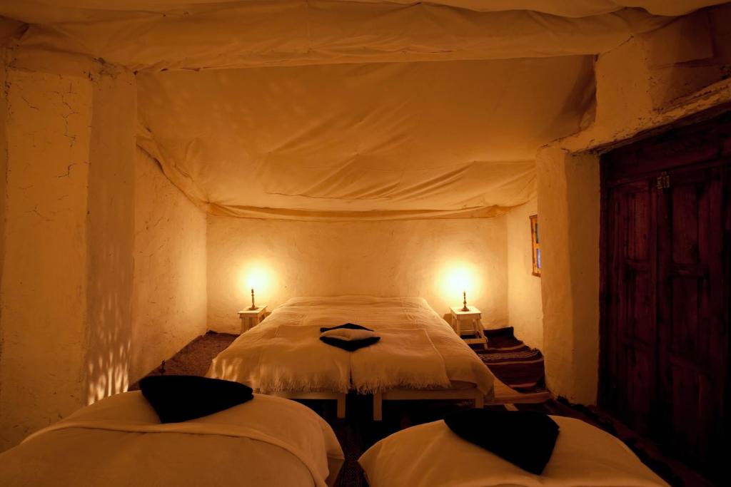 Rúm í herbergi á Bivouac La Dune Blanche