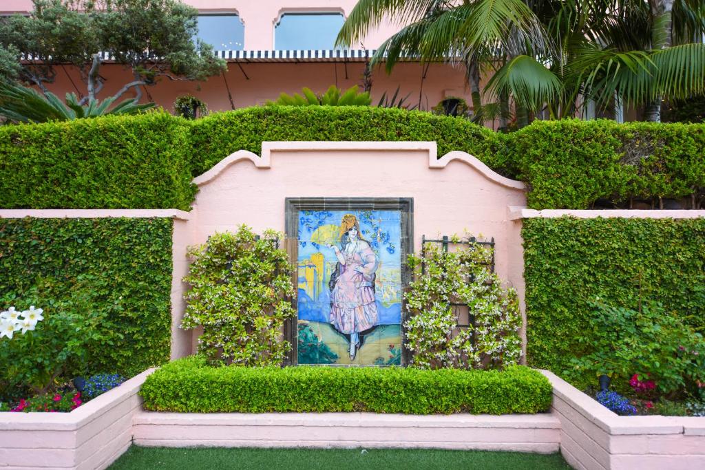a small pink house with a painting on it at La Valencia Hotel in San Diego
