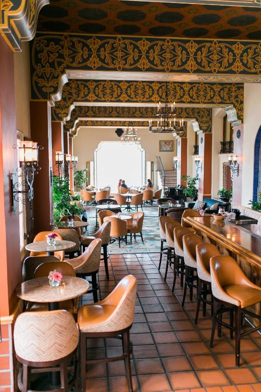 a restaurant with a lot of tables and chairs at La Valencia Hotel in San Diego