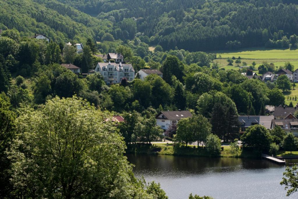 a village on the river in a valley at Rursee-Panorama in Simmerath