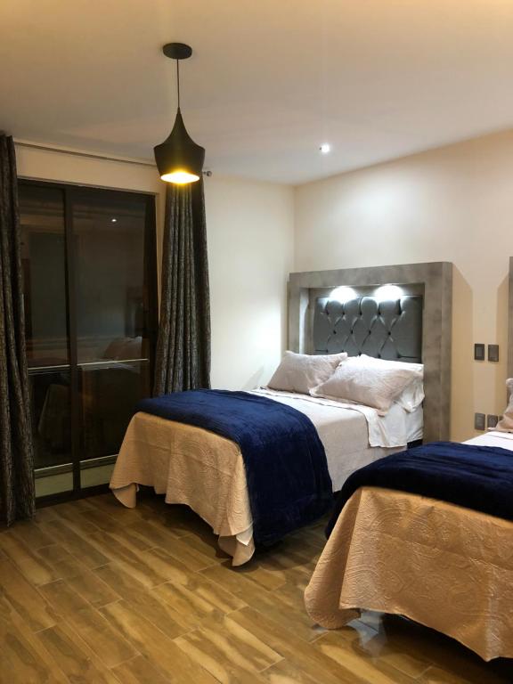 Postel nebo postele na pokoji v ubytování Gold Palace Hotel
