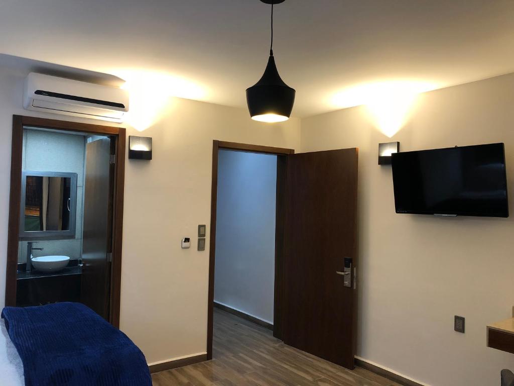 TV a/nebo společenská místnost v ubytování Gold Palace Hotel