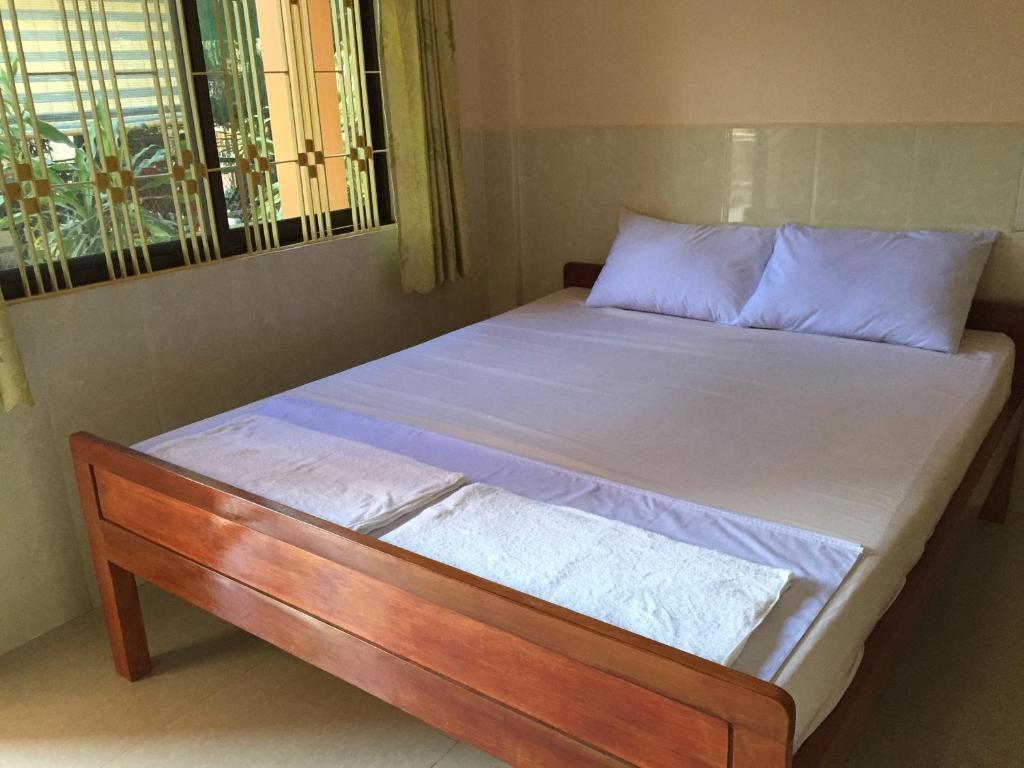 Postel nebo postele na pokoji v ubytování Ta Eng Guesthouse
