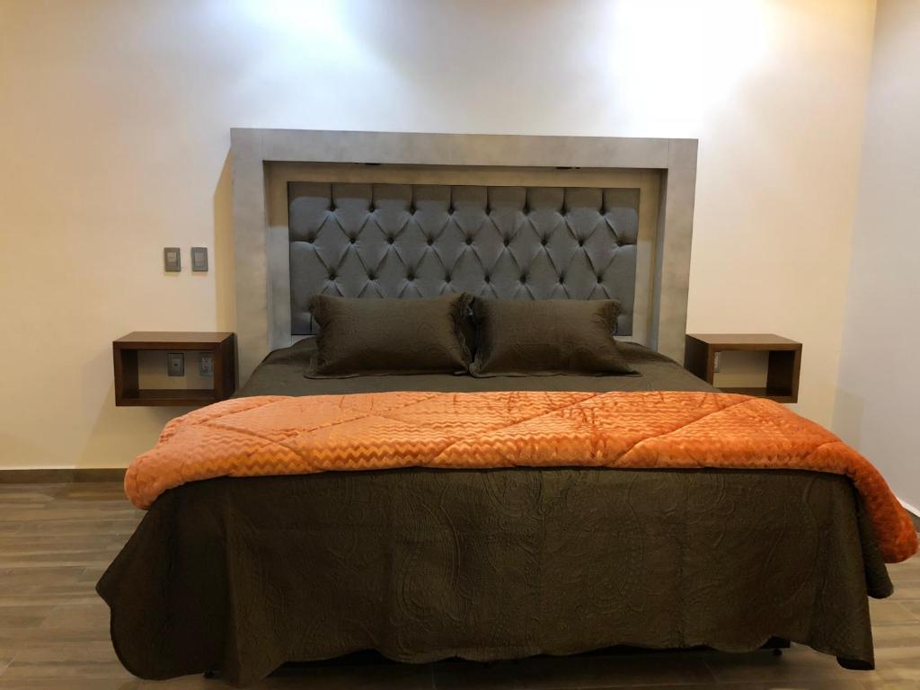 Postel nebo postele na pokoji v ubytování Gold Palace Hotel