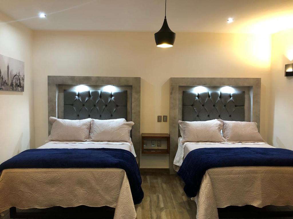 Postel nebo postele na pokoji v ubytování Gold Palace Hotel