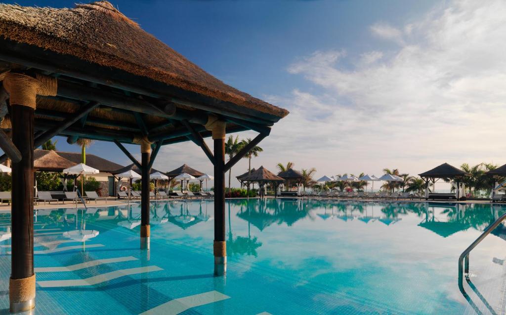 a swimming pool at the resort at Red Level at Gran Melia Palacio de Isora - Adults Only in Alcalá