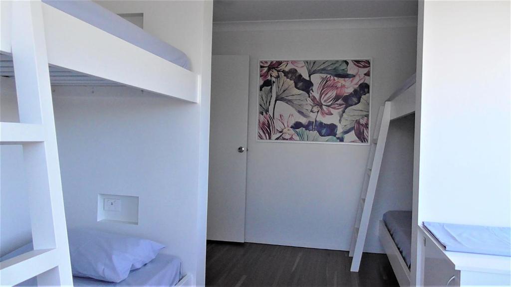 Postel nebo postele na pokoji v ubytování Yeppoon Beachhouse